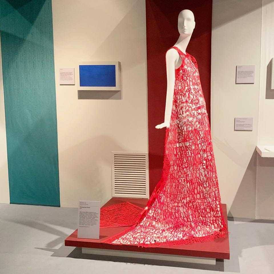 3D printed Names Dress from Sylvia Heisel on display in gallery.